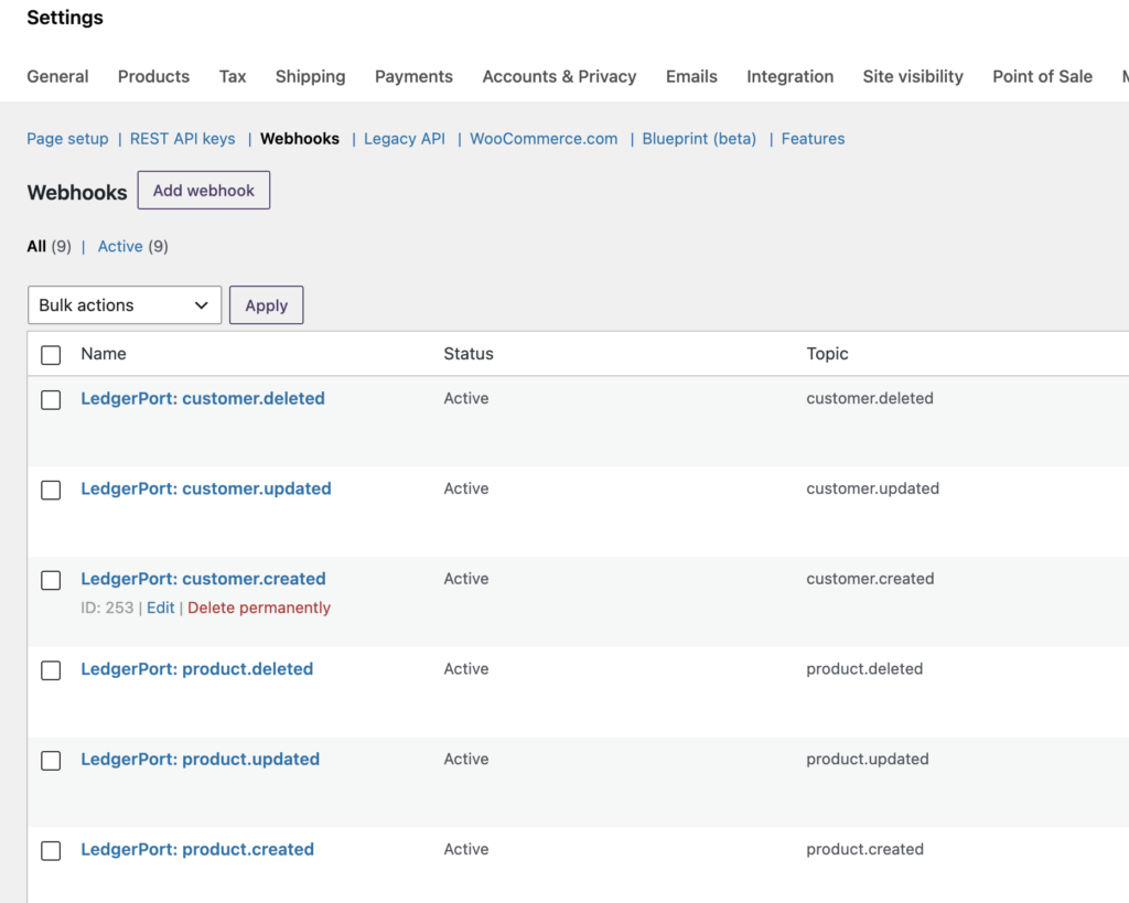 LedgerPort provisioning screen during WooCommerce connection showing automatic REST API key creation and webhook registration steps